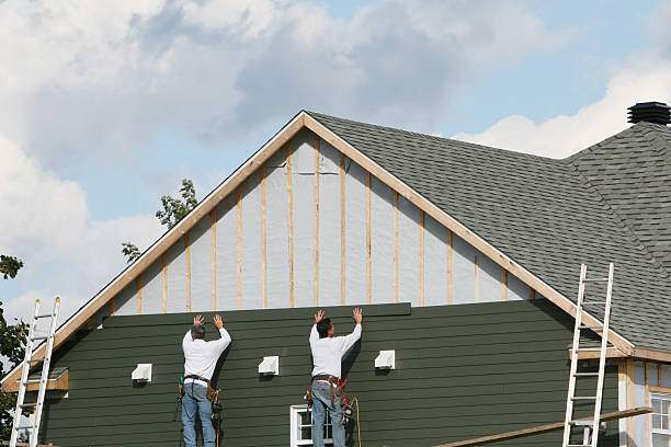 Professional Storm Damage Siding Repair technician working in Eaton, OH